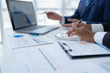 Businessman discussing commercial real estate sector faces risks as financial.	