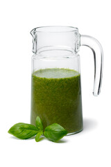 Glass can with homemade basil oil close up isolated on white background