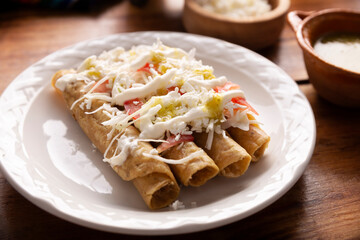 Tacos Dorados. Mexican dish also known as Flautas, consists of a rolled corn tortilla with some filling, commonly chicken or beef or vegetarian options such as potatoes.