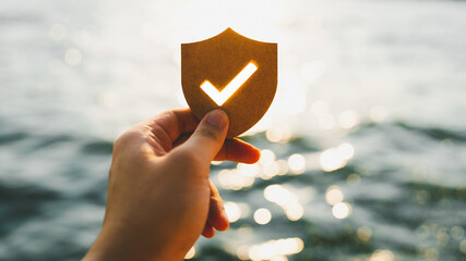 Businessman holding shield protect icon, Security protection and health insurance. The concept of...