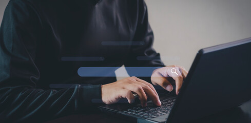 Search Engine Optimization SEO, data searching technology. Man's hands typing on laptop computer to search the information via internet web browser. network, database, information system.