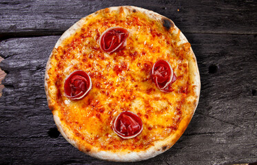 Parma ham pizza baked in the wood oven