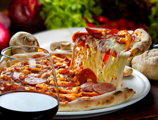 Slice of pizza raised