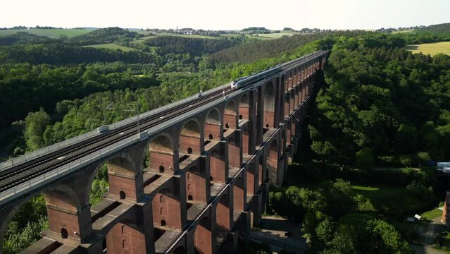 Aerial View at the train on Brick Bridge and Railway track in Western Germany crossing the Goltzsch Valley. G&ouml;ltzschtalbr&uuml;cke, G&ouml;ltzsch Viaduct