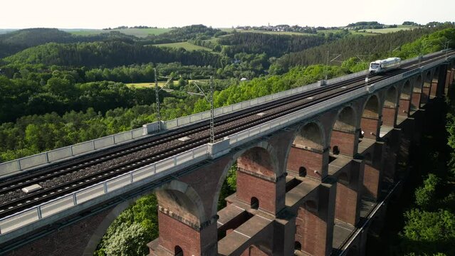 Aerial View at the train on Brick Bridge and Railway track in Western Germany crossing the Goltzsch Valley. G&ouml;ltzschtalbr&uuml;cke, G&ouml;ltzsch Viaduct