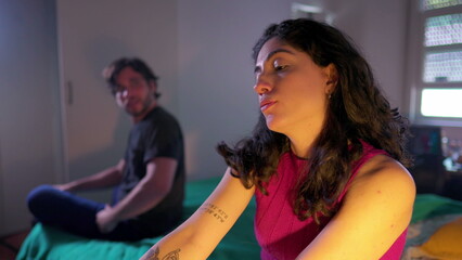 Dismissive young woman ignoring male partner during relationship argument. Couple feeling disconnected and in the verge of a break up