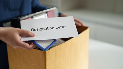 Business people giving a resign letter to quit a job at office..