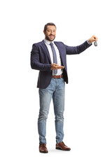Young professional man holding a car key and pointing