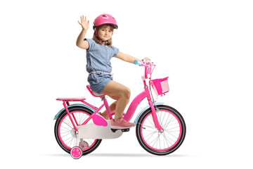 Girl riding a bicycle with a helmet and waving at camera