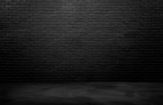 industrial background for product displayed. black brick wall background, rough concrete, plastered concrete floor, with lights from above. lighting effect on empty brick wall background for design.