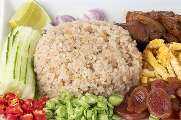 Close up Fried Rice with Shrimp Paste Stir fried rice with shrimp paste, served with fried Chinese sausage, slices of omelettete, and vegetables