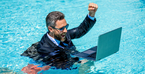 successful man has business video call in weekend with laptop. photo of man has business video call