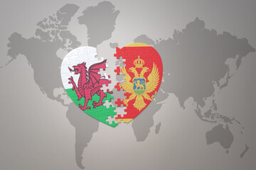 puzzle heart with the national flag of montenegro and wales on a world map background.Concept.