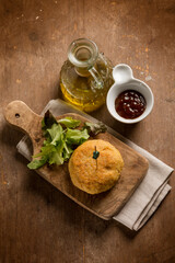 vegetarian hamburger with green salad and ketchup sauce