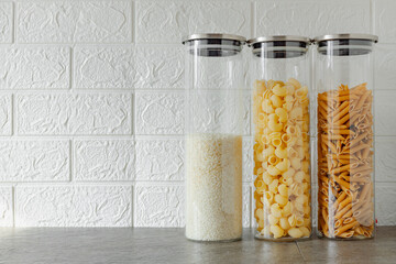 food storage glass jars, rice and pasta in transparent containers, eco storage in the kitchen, no waste house