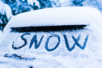 Snowy car in winter with title snow, Liptovsky Mikulas, Slovakia.