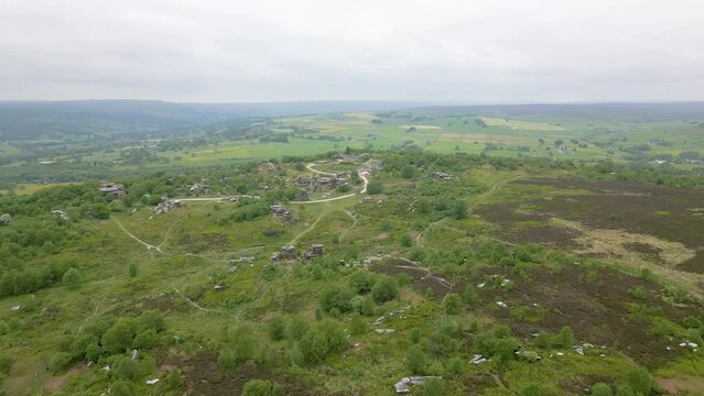 This aerial drone video shows the Brimham Rocks which are ancient rocks in Yorkshire Dales National Park, England. 