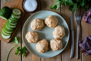A dietary dish for the whole family: hearty steamed meat meatballs baked in breadcrumbs.A dish for children: pork meatballs. Close-up. View from above