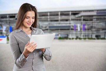 Portrait of a successful young business woman hold digital tablet