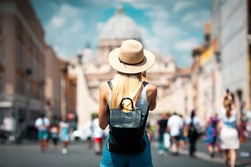 Deurstickers Young attractive smiling girl tourist exploring new city at summer © Vasily Makarov