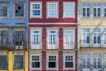 Fototapeta na wymiar Portuguese house colourful facade. Old houses in city of porto old town, Portugal.