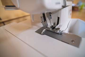 Close-up of the needle mechanism of a household electric sewing machine