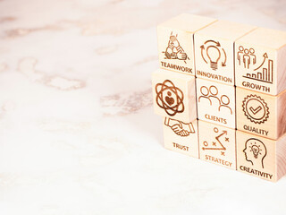 Symbols of core values on wooden cubes