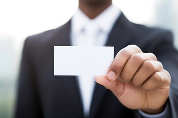 businessman holding blank business card