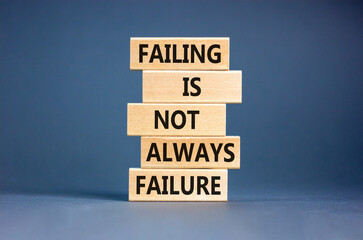 Failure or failing symbol. Concept words Failing is not always failure on wooden block. Beautiful grey table grey background. Business, failure or failing concept. Copy space.