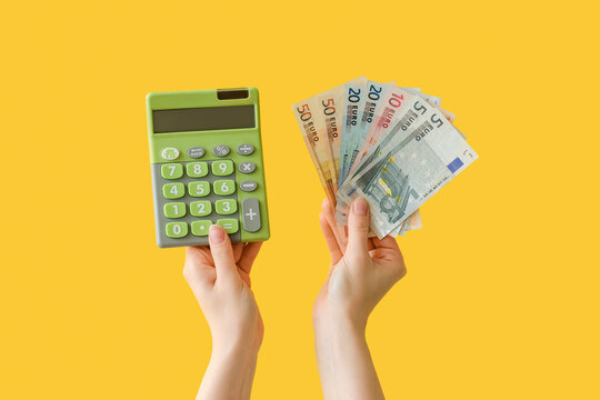 Woman with euro banknotes and calculator on yellow background