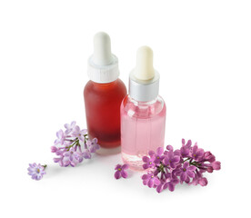 Fototapeta na wymiar Bottles of cosmetic oil with beautiful lilac flowers on white background