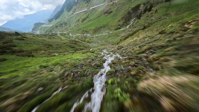 Flying close over a waterfall on the col du tourmalet in France.