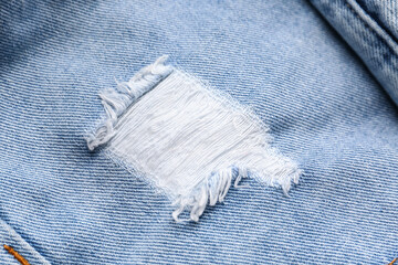 Stylish denim ripped jeans, closeup