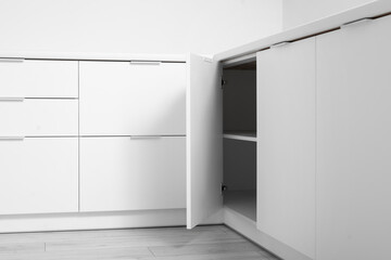 White counters with drawers in light kitchen