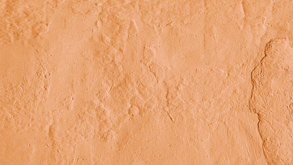Vintage, old stucco plaster wall background, close up grunge texture of orange painted cement, concrete wall texture. Wallpaper, backdrop, architecture design element