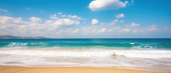 Obraz premium Beautiful background image of tropical beach. Bright summer sun over ocean. Blue sky with light clouds, turquoise ocean with surf and clear sand. Harmony of clean environment. Wide format