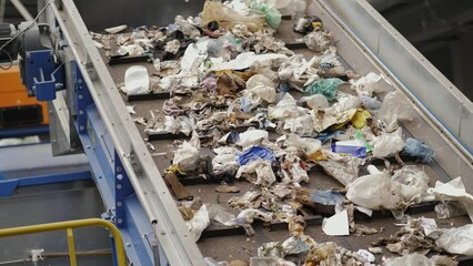 Garbage Recycling Factory line, Plastic cubes for recycle Plant, Bales of pressed boxes, rubbish warehouse collection. Preparation of recyclables for recycling, Plastic city garbage.