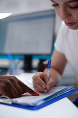 Doctor helping patient signing paperwork of medical insurance document form for sickness healthcare...