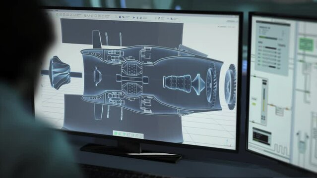 An engineer examining the blueprint of multiple heavy machine parts in a program. Engineer using the development program to design detail blueprints. Engineering program inspecting turbine blueprint.