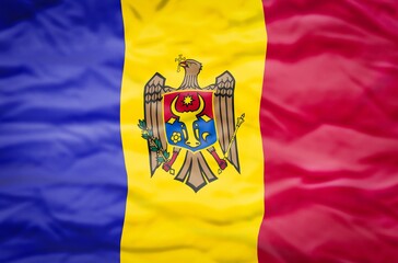 Moldavia flag on a wavy background. Wavy flag of Moldavia fills the frame.