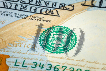 Fragment of a 100 US dollar banknote of the new design, close-up. 100 american dollars. Wealth concept. Background or texture