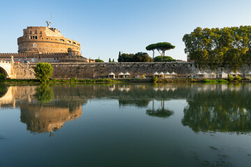 Saint Angel Castle and bridge seen from Tiber river canal in Rome. Italy