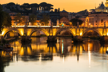 Fototapeta premium Sant Angelo bridge at sunset in Rome. Italy