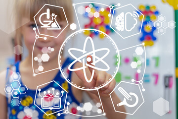 Little girl using virtual touch screen presses icon: atom. Science Education Concept. Modern...