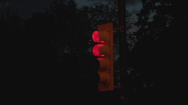traffic light with double red and turn signal at night