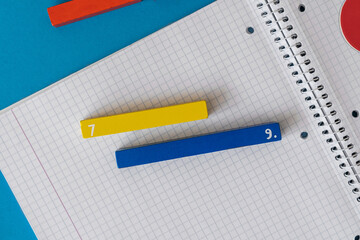Fototapeta Creative Сolorful math fractions on blue background. Interesting funny math for kids. Education, back to school concept. Geometry and mathematics materials. Flat lay, top view	 obraz