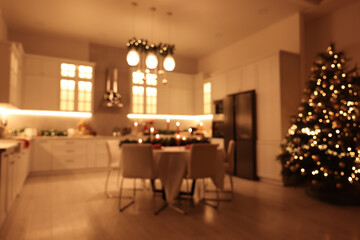 Blurred view of cozy kitchen decorated for Christmas. Interior design