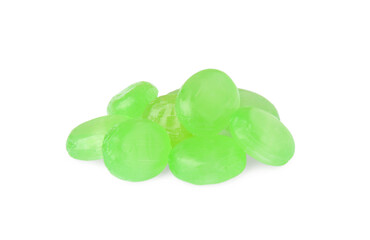Many light green cough drops on white background