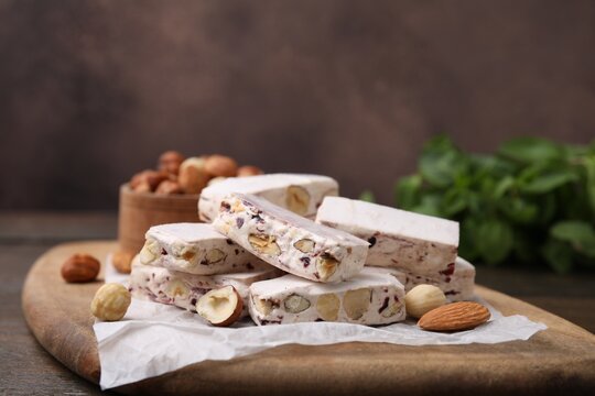 Pieces of delicious nutty nougat on board