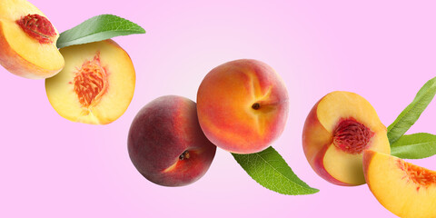 Juicy fresh peaches with green leaves falling on light violet background